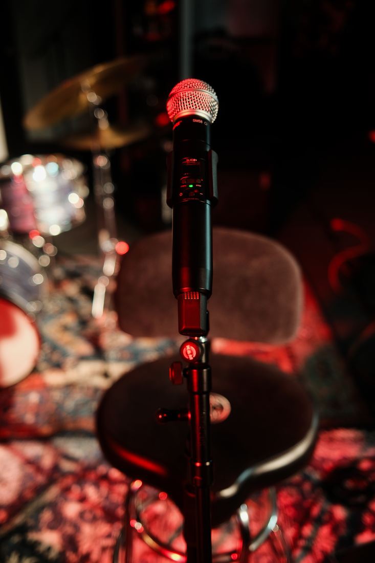 Microphone and cymbal under red light