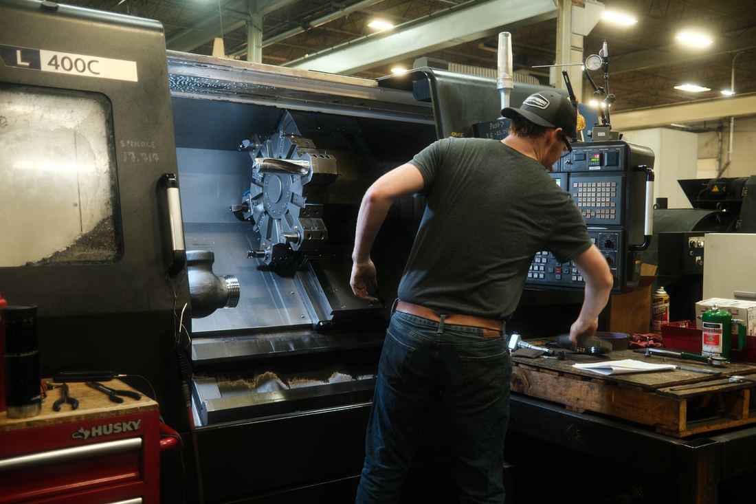 Machinist working at a lathe